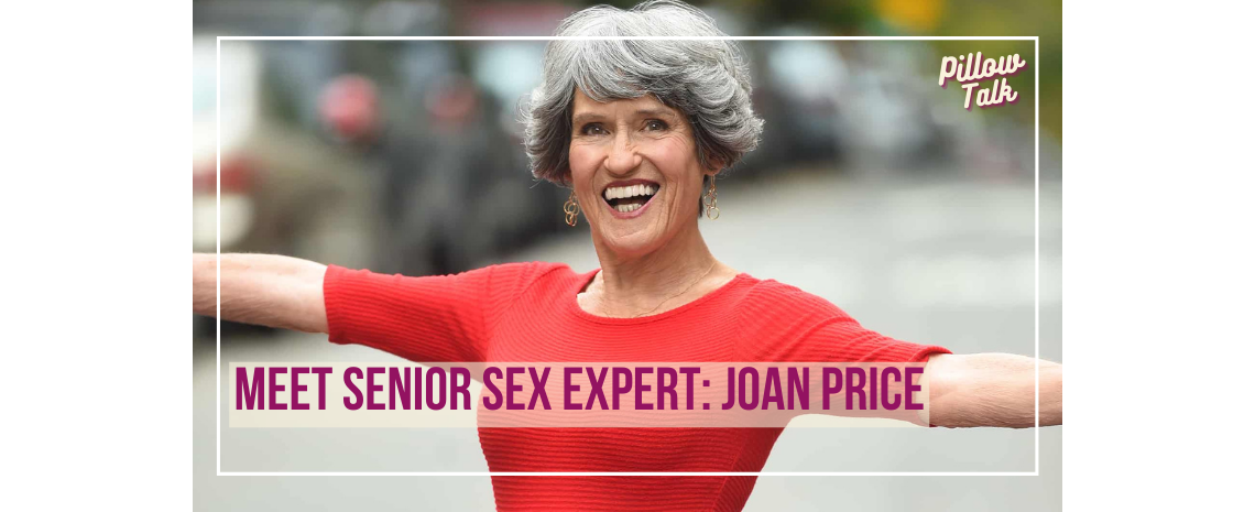 Older woman with short, styled gray hair, stands outside, wearing a form-fitting red dress with arms stretched out, smiling. A white frame surrounds image, text in magenta “Meet Senior Sex Expert: Joan Price” "Pillow Talk" in magenta is in upper right.