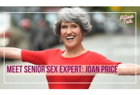 Older woman with short, styled gray hair, stands outside, wearing a form-fitting red dress with arms stretched out, smiling. A white frame surrounds image, text in magenta “Meet Senior Sex Expert: Joan Price” "Pillow Talk" in magenta is in upper right.