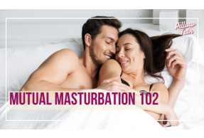 Couple laying in bed, on their backs,  turned in towards each other, embracing. A white frame surrounds image, text in magenta "Mutual Masturbation 102". "Pillow Talk" in magenta cursive is in upper right corner.