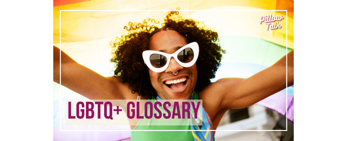 Black man with natural black hair holding a rainbow flag over their head, wearing large white sunglasses, a nose ring, and smiling. A white frame surrounds image, text in magenta “LGBTQ+ Glossary.” "Pillow Talk" in magenta cursive is in upper right corner