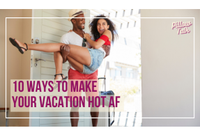 Black couple walking into a hotel room. Man is carrying woman over the threshold, both are smiling. A white frame surrounds image, text in magenta “10 Ways to Make Your Vacation Hot AF” Pillow Talk" in magenta cursive is in upper right corner.