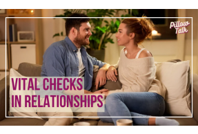 white couple sitting on a couch talking and listening to each other. A white frame surrounds the image and in magenta letters text reads "Vital Checks in Relationships". A logo reading "Pillow Talk" in magenta cursive is in upper right corner