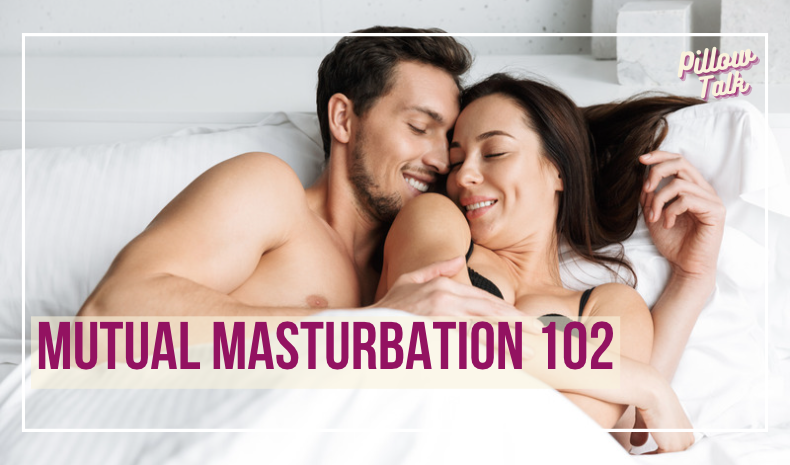 Couple laying in bed, on their backs,  turned in towards each other, embracing. A white frame surrounds image, text in magenta "Mutual Masturbation 102". "Pillow Talk" in magenta cursive is in upper right corner.